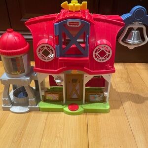 Little people caring for animals barn